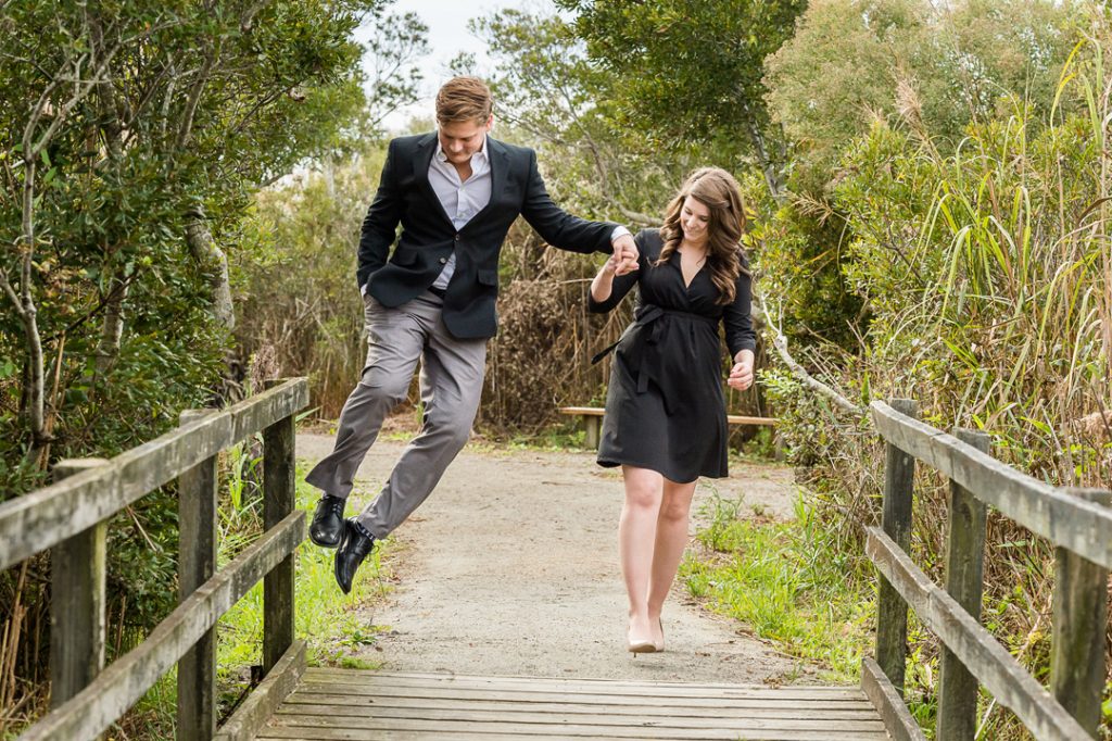 Fun loving couple at their engagement portrait session in Virginia Beach