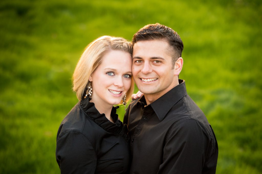 Engagement session couple looking at the camera