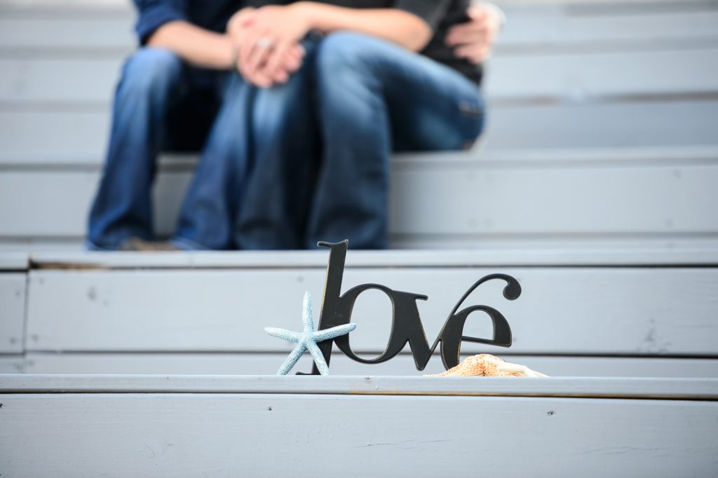 Engagement session couple with love sign