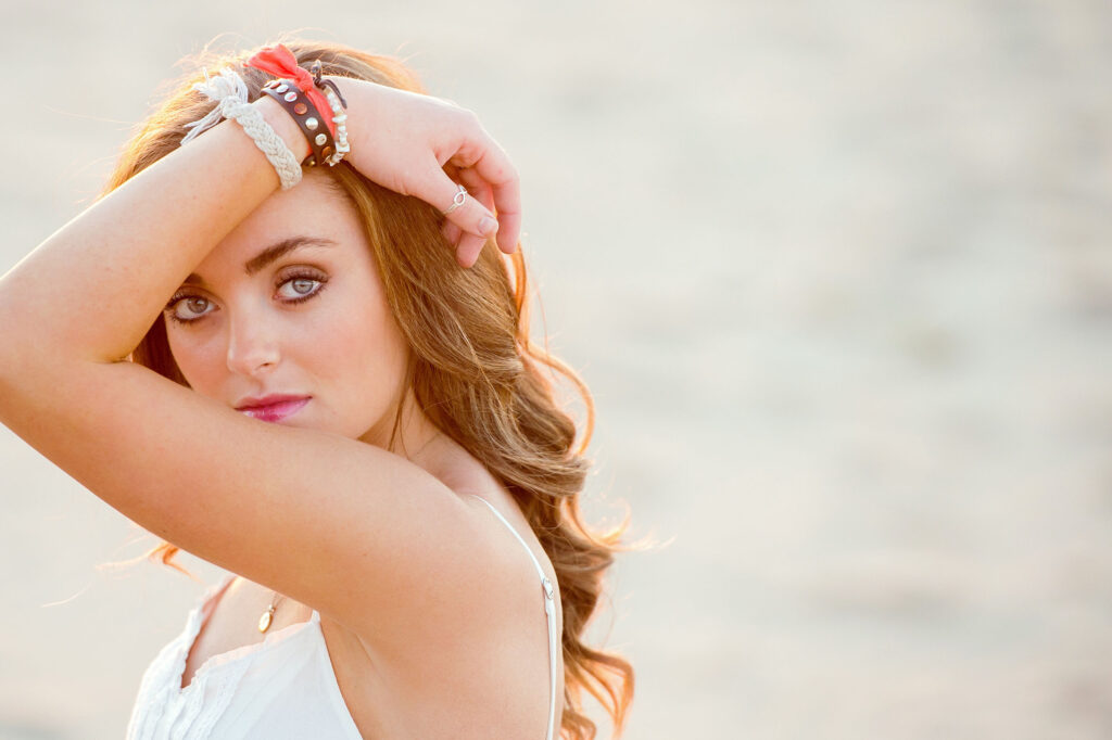 Beautiful girl in a model pose for her senior portrait in Virginia Beach