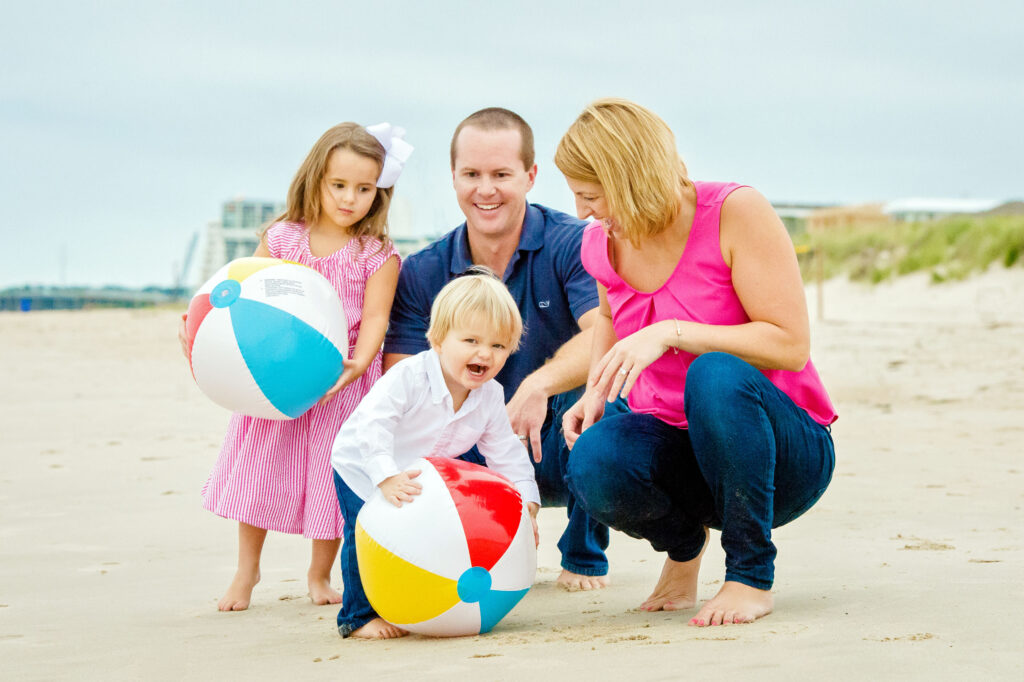 Family portraits with beach balls in Virginia Beach