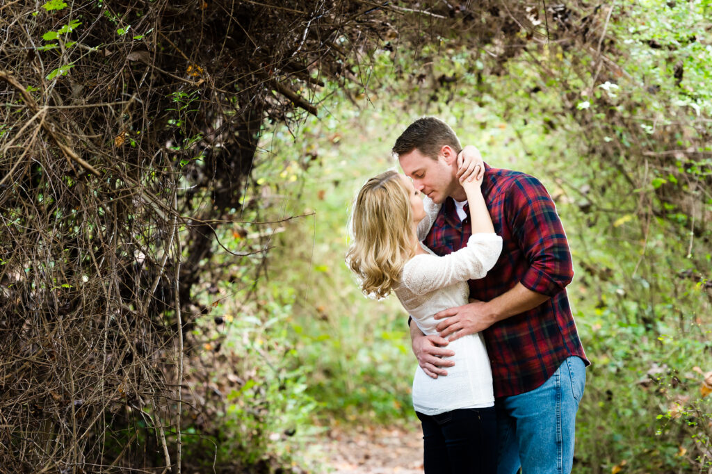 Engagement session couple dipping with backlight flash