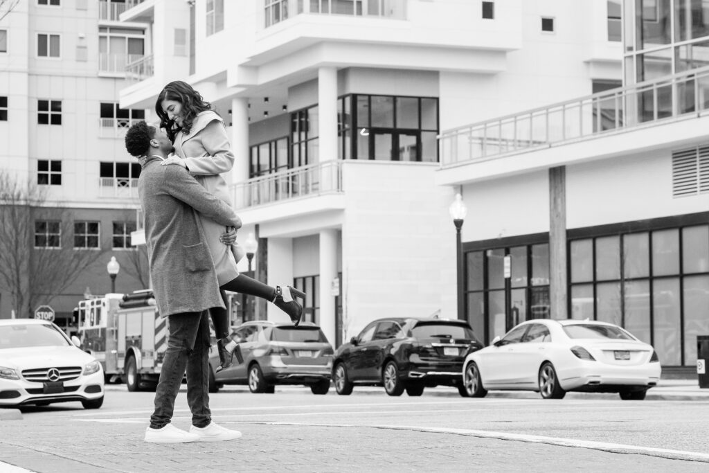 Engagement session couple playing in the street