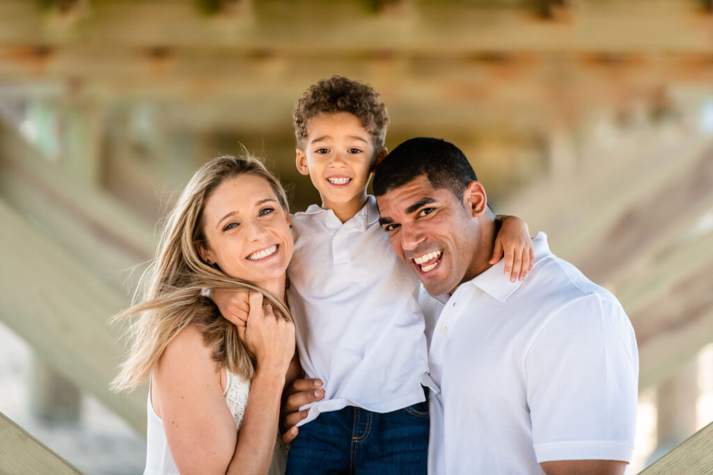 Cute little family portrait under the pier at Little Island Park