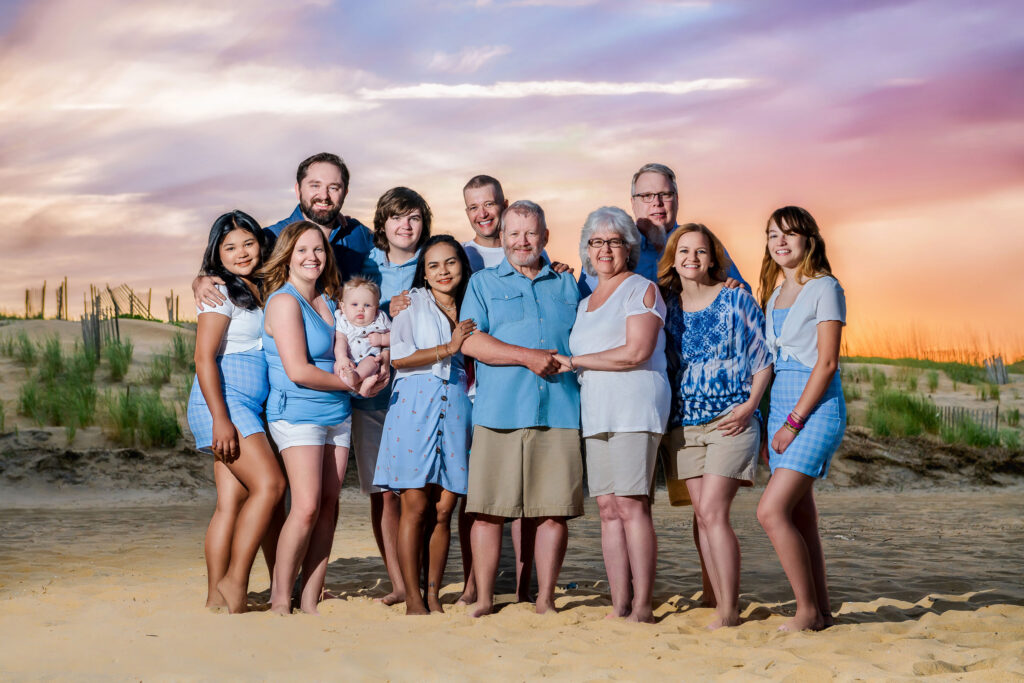 Large family portrait session with beautiful sunset colors in Sandbridge