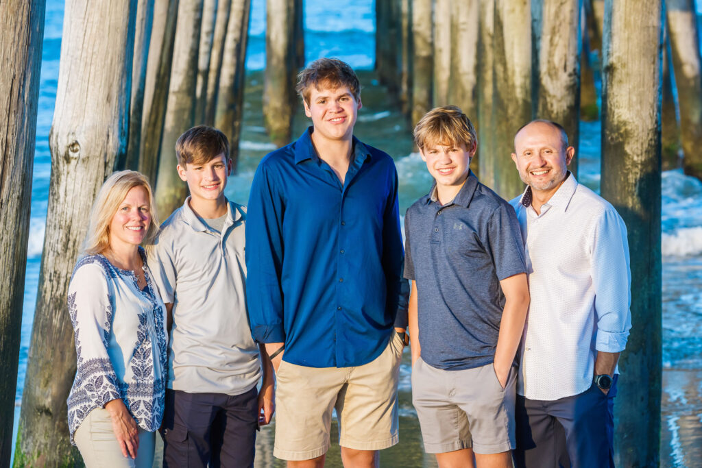 Family portrait under the pier in Sandbridge