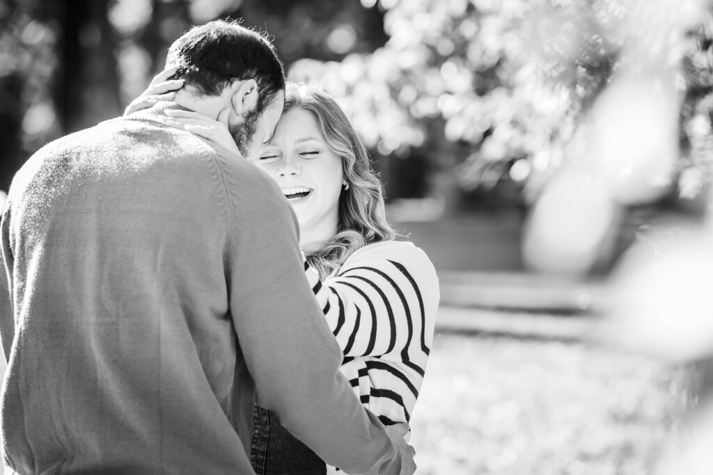 laughing couple at engagement portrait session