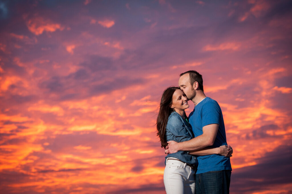 Beautiful sunset colors of a young couple at Little Island Park in Sandbridge