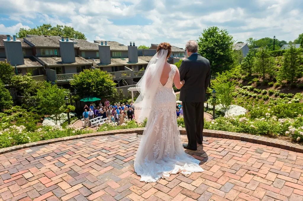 Bride and her father overlooking the sunken garden before wedding ceremony begins