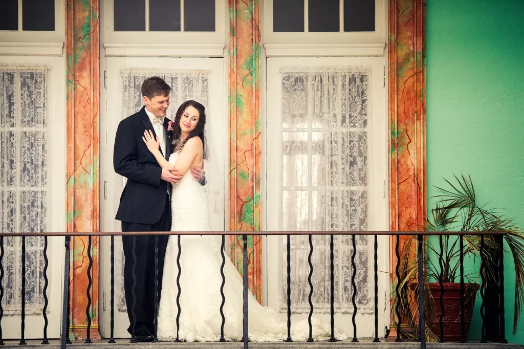 Bride and Groom on a balcony of the Cavalier Hotel