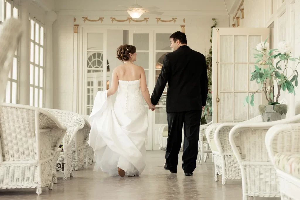Bride and Groom walking the hallways of the Cavalier Hotel