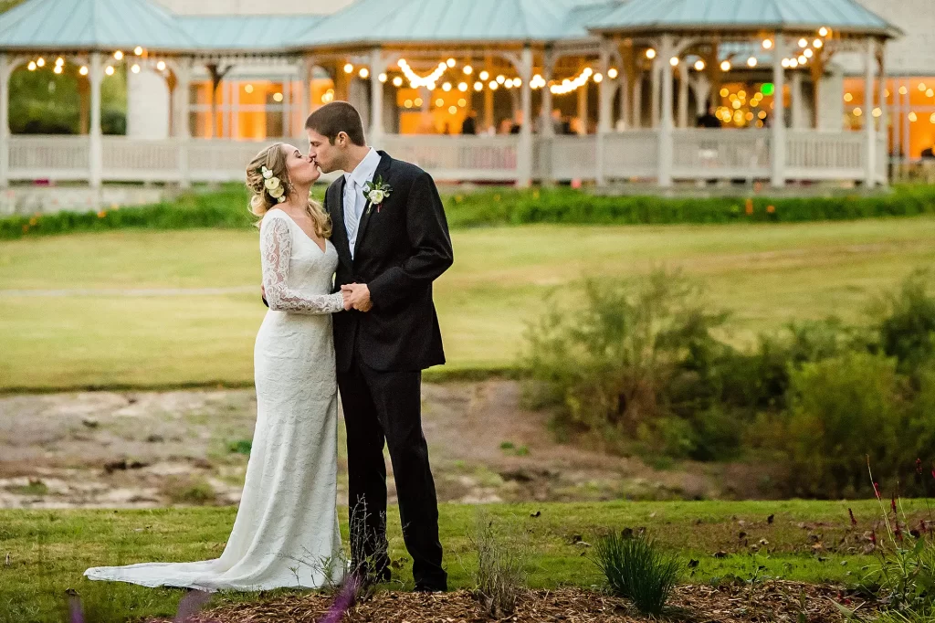 Bride and Groom kissing at Norfolk Botanical Garden wedding venue