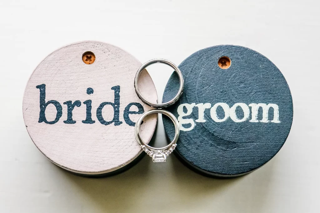 wedding rings on bride and groom boxes